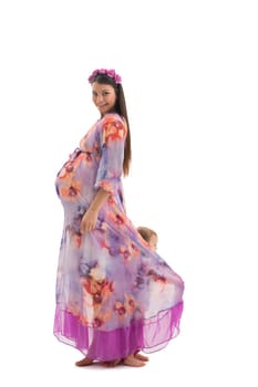 Pretty pregnant girl in long dress profile isolated shot