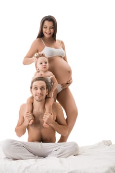 Happy family with pregnant mother isolated shot