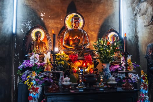 Buddha statues inside temple at the Long Son Buddhist Pagoda in Nha Trang in Vietnam
