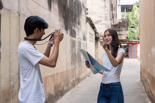 A couple navigates an enchanting alley capturing memories while the rich history of their travel destination.