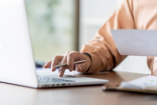 A focused individual engaged in a business strategy meeting at home emphasizing productivity in a digital workspace.