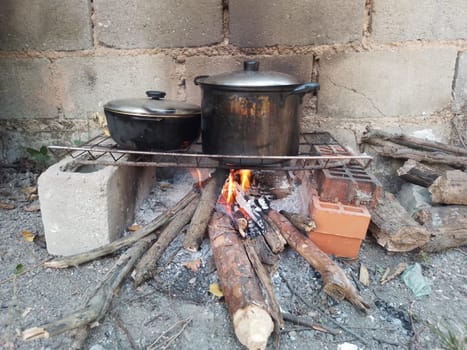 Conventional cooking stoves typically run on fuel such as wood charcoal, firewood, and similar materials. Wood fired soup. High quality photo