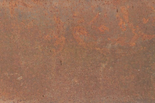 A vibrant close-up of rusted metal with rich orange and brown tones, displaying corrosion and natural patterns suitable for industrial-themed designs.