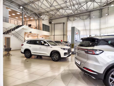 Tumen, Russia - November 09, 2024: Beautiful car in showroom of dealership Chery