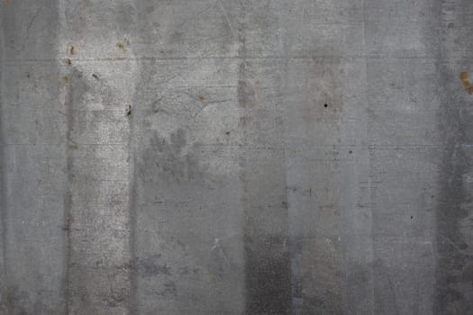 A rough metallic surface in gray tones, showcasing weathered imperfections and industrial textures for modern or rustic designs.