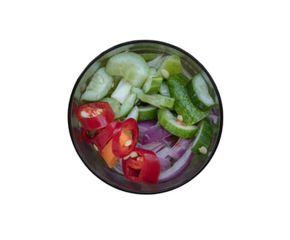 Ajat - Top view of Homemade thai cucumber slices, chili slices and shallots relish slices and vinegar in glass isolated on with background with clipping path. Selective focus.