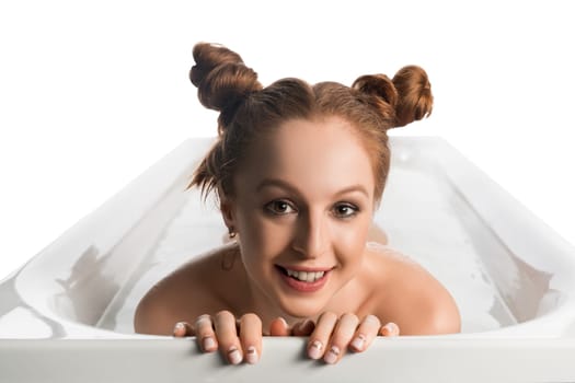 Pretty nude girl with funny hairstyle in foam bath isolated shot