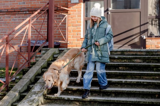 Girl With Golden Retriever Leaves House In Spring, Dog In City