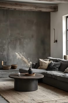 Inside a cozy living room of a wood building, there is a comfortable couch, a coffee table, and a soft rug on the hardwood flooring