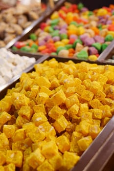 Assorted Colorful Turkish Delight Cubes on a White Plate,