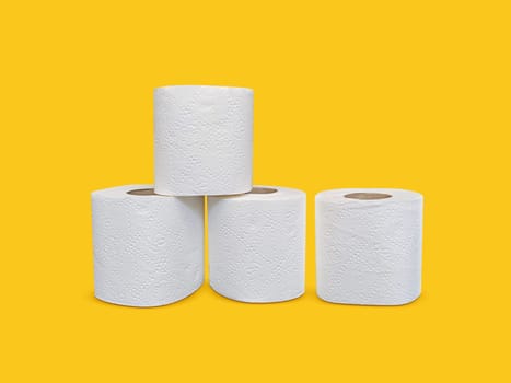 Toilet paper roll on yellow background