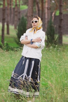 Fashion outdoor photo of beautiful young woman looking like elegant lady,wearing white jacket and accessories. Scarf trendy fashion accessory season