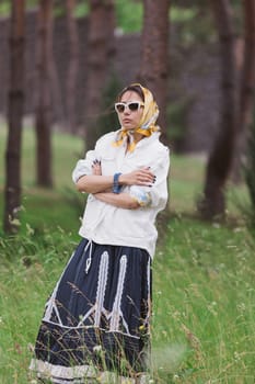 Fashion outdoor photo of beautiful young woman looking like elegant lady,wearing white jacket and accessories. Scarf trendy fashion accessory season