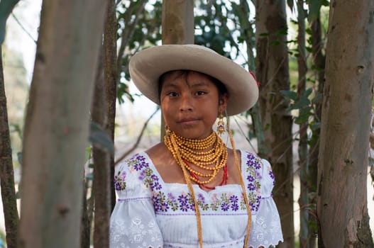Captivating Ecuadorian Indigenous Youth Adorned in Ancestral Gold Jewelry. High quality photo