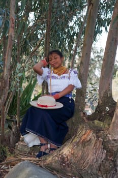 Serenity in Tradition: Indigenous Woman Napping on an Amazon Tree. High quality photo
