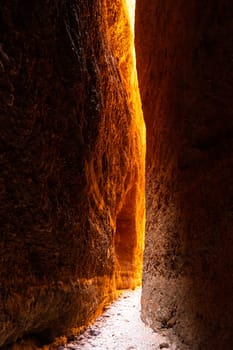 Natural rock formation that lights up bright orange for an hour a day as the sun passes over in western Australia.