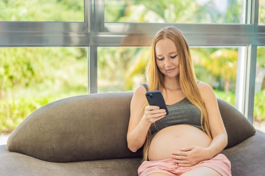 Mobile pregnancy online maternity application. Pregnant mother using phone. Pregnancy, medicine, pharmaceutics, health care and people concept.