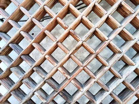 Detailed wooden lattice structure creates a complex pattern, featuring soft textures with space for additional text or design elements.