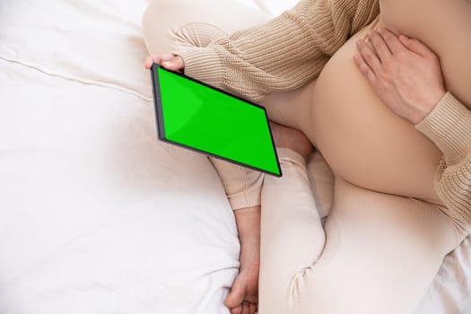 This image shows a cozy scene with a tablet in hand, setting a perfect atmosphere for relaxation and lifestyle