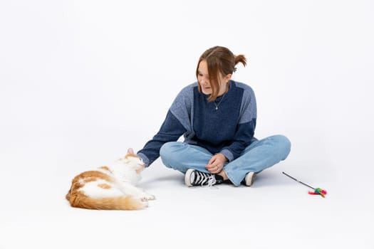 A joyful interaction between a person and a friendly cat, highlighting affection, companionship, and playfulness
