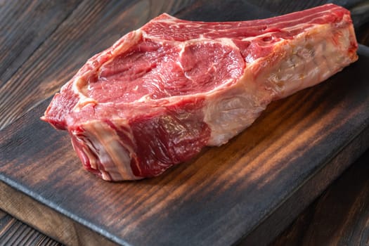 Fresh, high-quality cowboy steak with perfect marbling, ideal for grilling or pan-searing