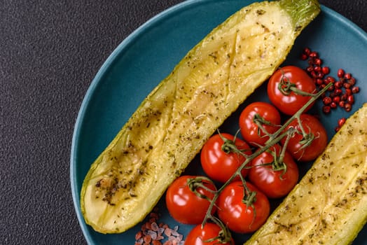 Delicious zucchini cut into two halves baked with salt, spices and herbs on a dark concrete background