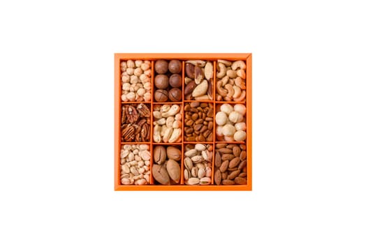 Box with various nuts cashew, macadamia, peanut, cedar, pecan, walnut, brazil, hazelnut on a white background
