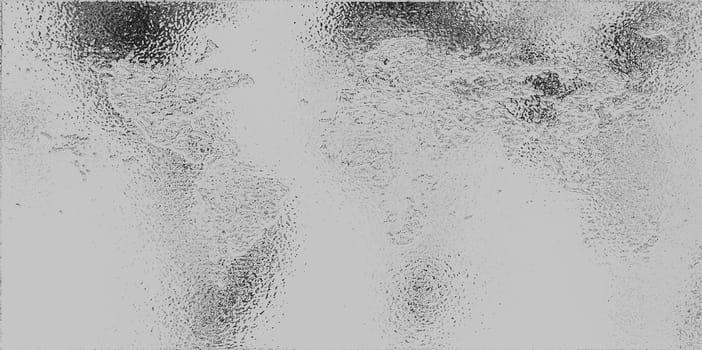 Abstract monochrome background with shiny glossy dotted spots and dots on a gray background