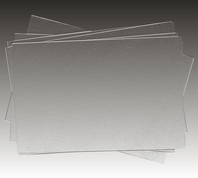 Grey abstract background with rough blank sheets of paper
