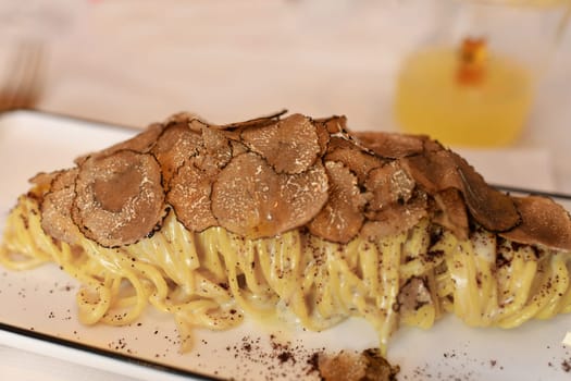 Italian pasta with truffle mushrooms in a restaurant