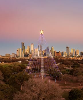 Aerial Zilker Christmas tree and downtown Austin Texas from metropolitan park at New Years