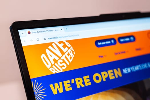 New York, USA - January 01, 2025: Dave and Buster website on computer screen displaying logo and announcement of new location opening