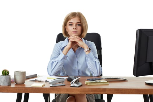 successful business woman looking at camera and using PC computer for online work at office