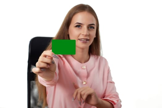 pretty business woman holding plastic credit card. focus on card