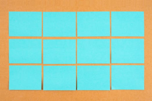 Blank sticky notes on wooden board for your text or message.