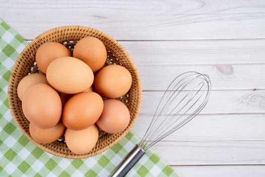 Organic chicken eggs and egg whisk Organic chicken eggs food ingredients concept.