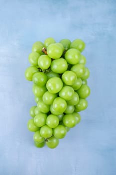 Fresh of Shine Muscat Grape on wooden blue background.