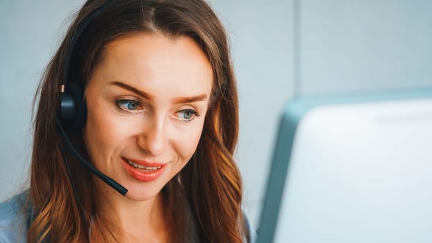 Business people wearing headset working in office to support remote customer or colleague. Call center, telemarketing, customer support agent provide service on telephone video conference call. Jivy