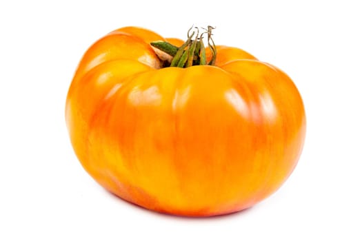 Whole yellow and orange tomatoes on white background