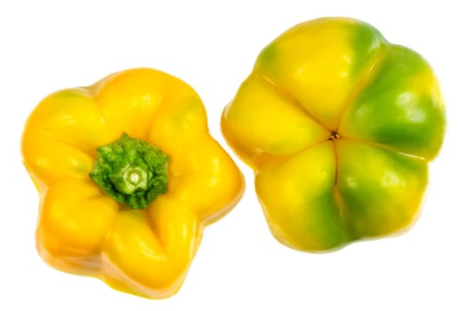 Set of fresh whole and sliced sweet yellow pepper isolated on white background.