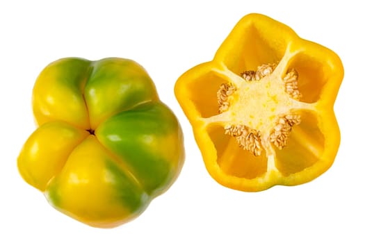 Set of fresh whole and sliced sweet yellow pepper isolated on white background.