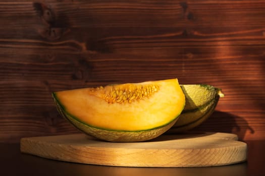 Orange melon harvested in the greenhouse of an organic fruit farm. Favorite fruits in summer.