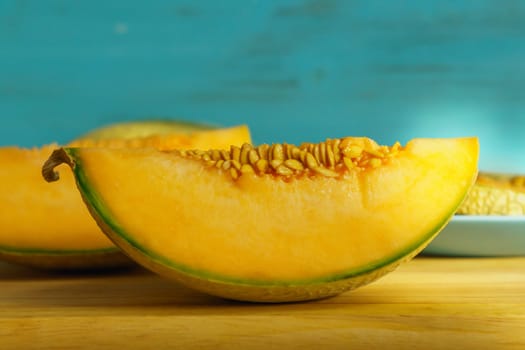 Piece of melon, close up of a table. How to peel and seed melon, close up process