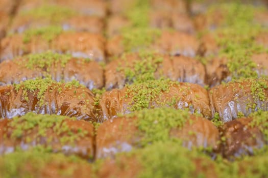 Enjoy authentic baklava slices that are beautifully drizzled with stunning pistachio crumbs