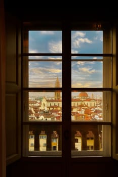View of the Basilica of Santo Spirito at sunset from a window of the Pitti Palace. Florence