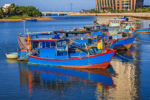 Traditional fishing boats near the colorful fishing port in Nha Trang, Vietnam.