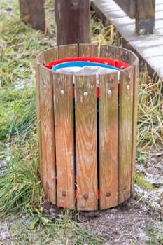 Shot of the trash bin by the bench in the park