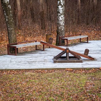 Shot of the wooden seesaw in the winter park