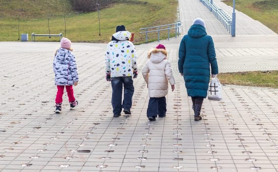 Family walks in the winter park