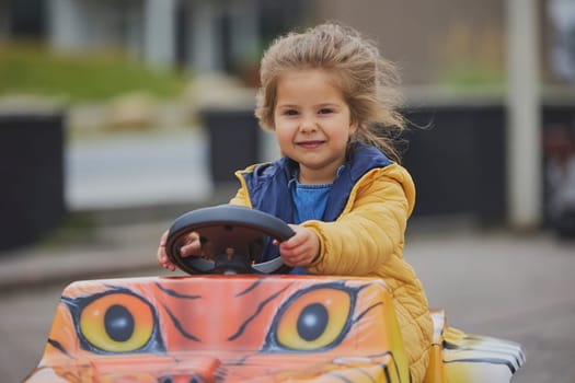 cute child playing in an amusement park in Denmark.